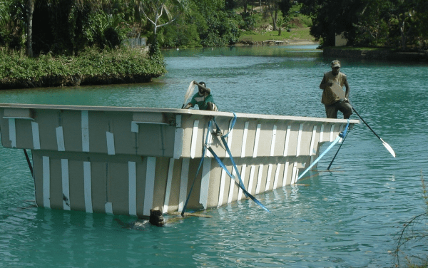 person rowing a swimming pool in a river