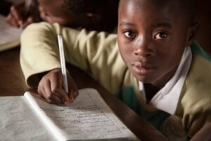 Agizo, 10, attends NRC’s Education programme at a primary school in Masisi, for children displaced by conflict, in Masisi, North Kivu, DRC. Copyright: Jonathan Hyams/Save the Children