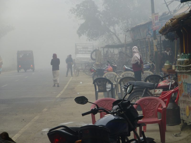 A street scene with polluted foggy air