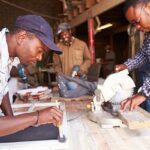 Developing Capabilities - Three South African men in a carpentry workshop