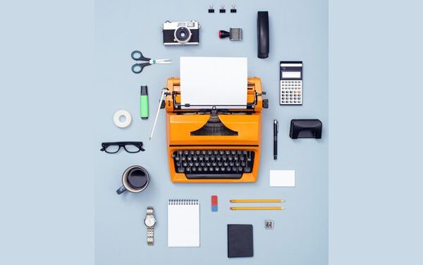 Image of typewriter and reporters equipment