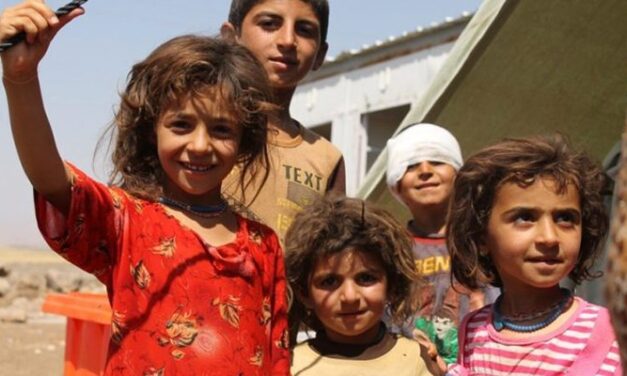 Group of children one with a bandage around his head