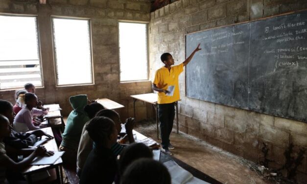 Young teacher at a blackboard