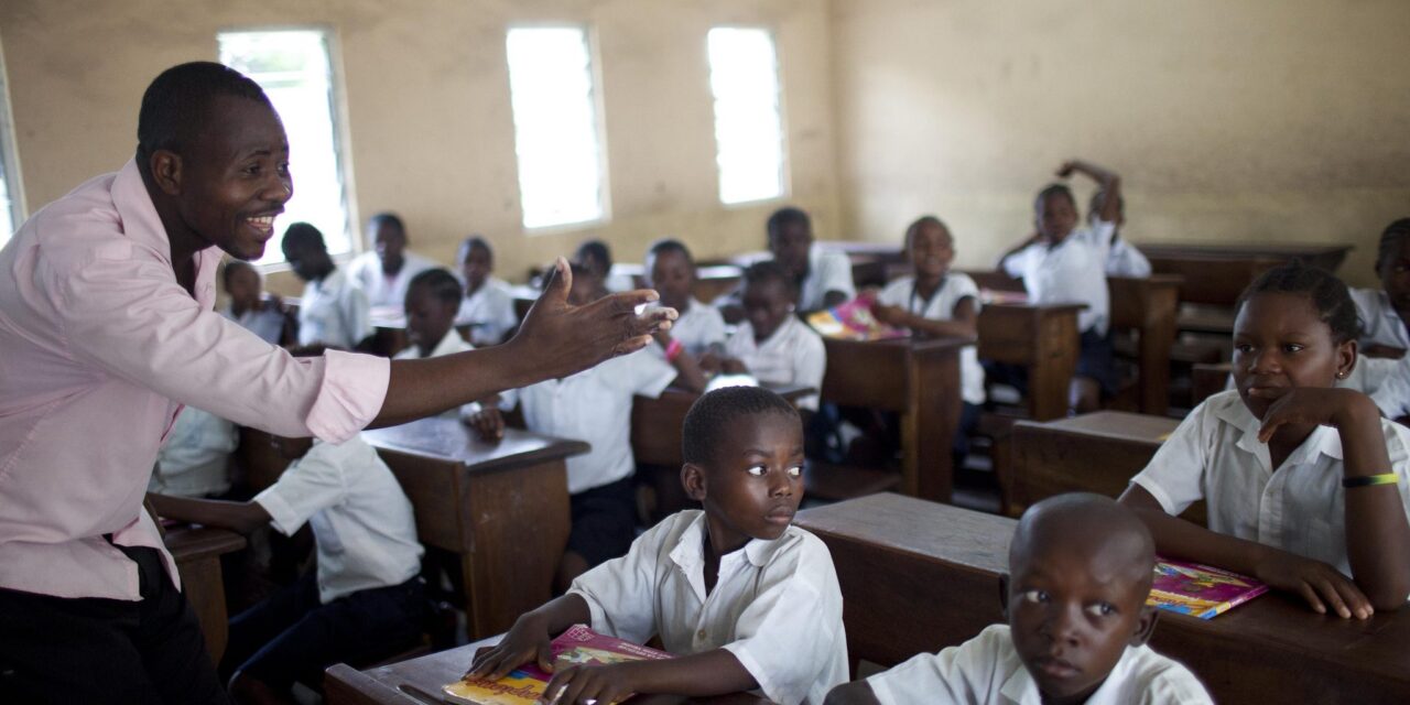 teacher asking students question in class in DRC