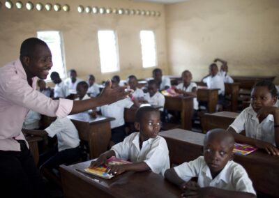 teacher asking students question in class in DRC