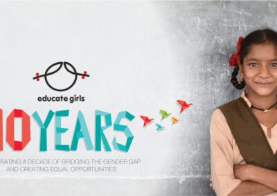 Girl smiling with her arms folded, Educate Girls 10 years briding the gender gap