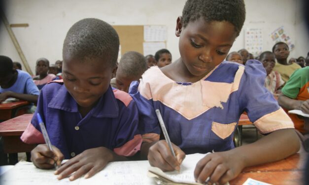 Children writing in a primary classroom in Malawi