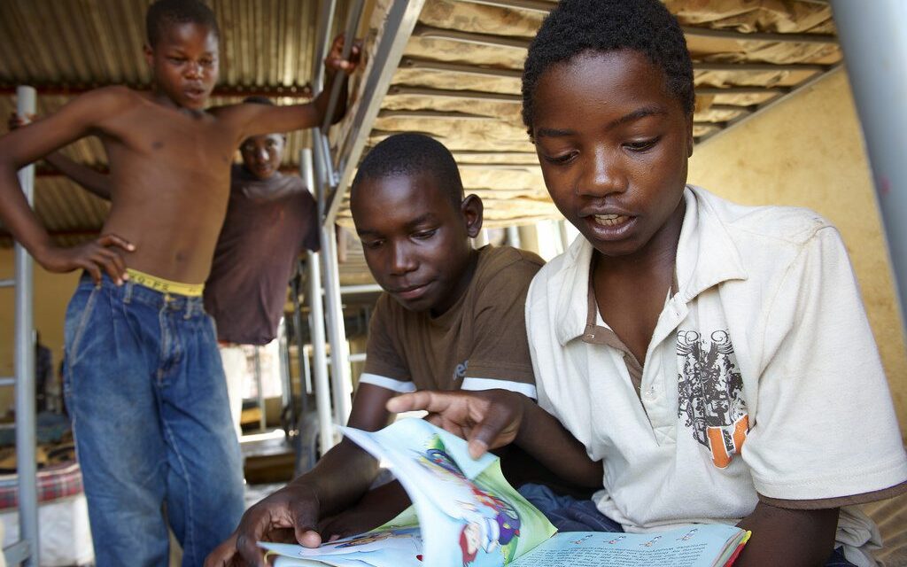 Boys looking at a book