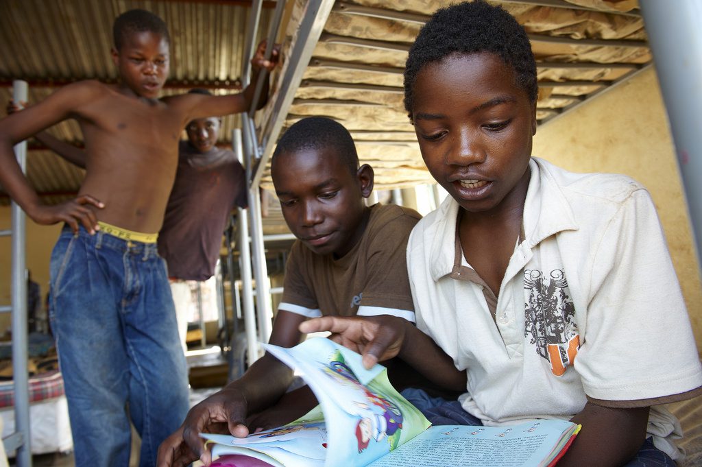 Boys looking at a book