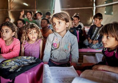 Children in a classroom in a tent