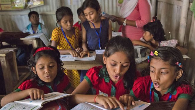 Children reading in a classroom