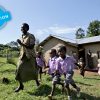 Getting every child ready to learn © UNICEF/UNI87197/Noorani
During a physical exercise session, Ms. Moonlight Olives (46), walks with children outside the Kisojo ECD Center in Kyenjojo district in western Uganda. After receiving UNICEF supported training on ECD (Early Childhood Development) (ECD) Caregivers, Ms. Olive helped establish an ECD Centre with help from her community.