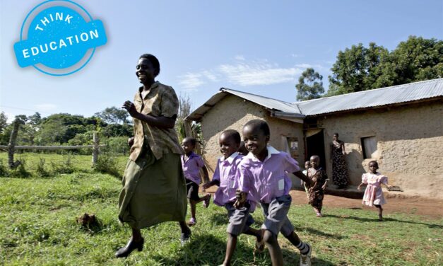 Think Education. Teacher and pupils running outside a school building