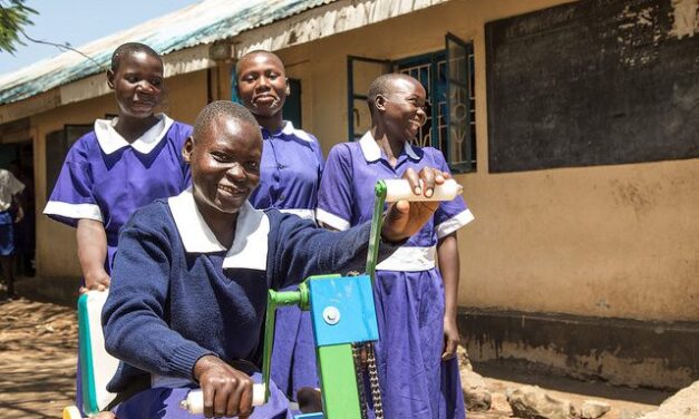 A disabled student with her class mates