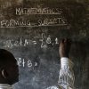 New research addresses global teaching crisis A teacher writes maths formulas on a blackboard at a school. Image Credit_Philippe-Lissac_Godong_Panos-Pictures