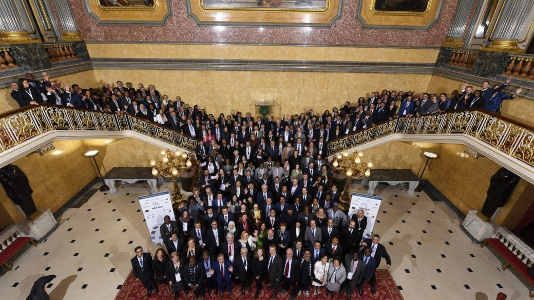 Group delegation photo on stairscase