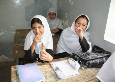 girls sitting at desks in class