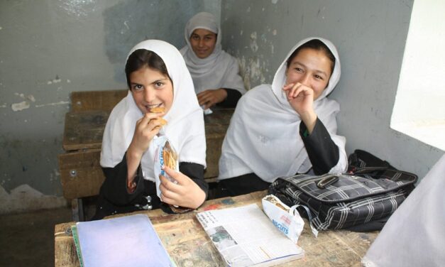 girls sitting at desks in class