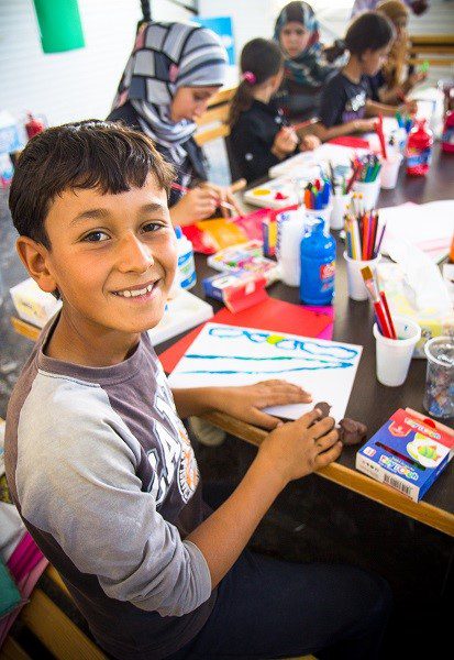 Smiling boy in class
