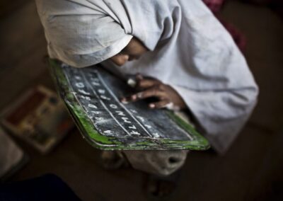 A student practices her english at the Girls' Government Primary School Syad Alipur. The school is located in the remote Panchkasi village, has no running water, no electricity and and no desks.