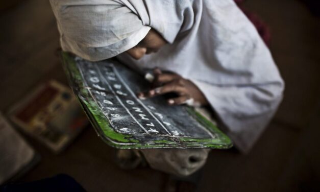 A student practices her english at the Girls' Government Primary School Syad Alipur. The school is located in the remote Panchkasi village, has no running water, no electricity and and no desks.