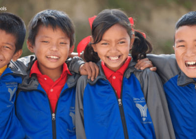 two children dressed in blue and red