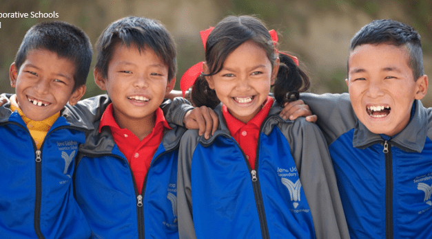 two children dressed in blue and red