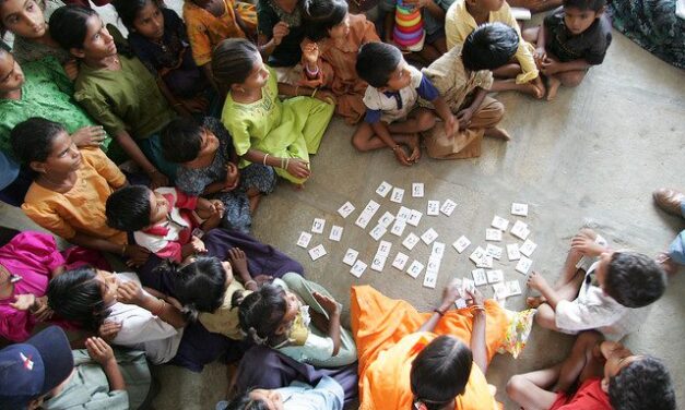 Children sitting on the floor of a classroom in Andhra Pradesh