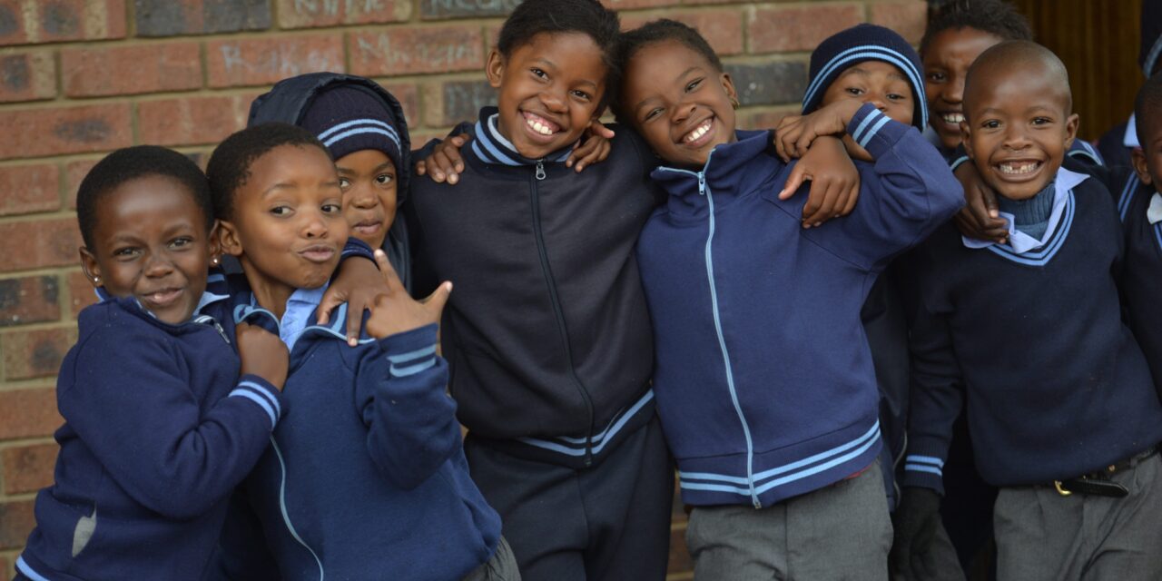 Group of happy smiling school boys