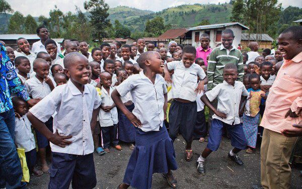 A group of School children outside a school