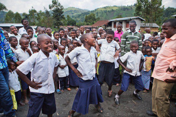 A group of School children outside a school