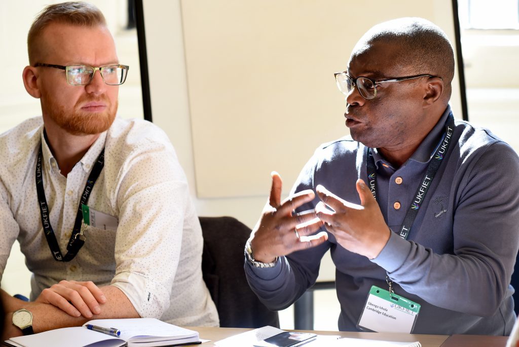 male presenter making a point at the conference