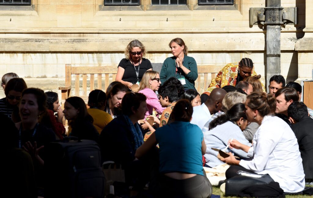 Delegates sitting outside at lunchtime 