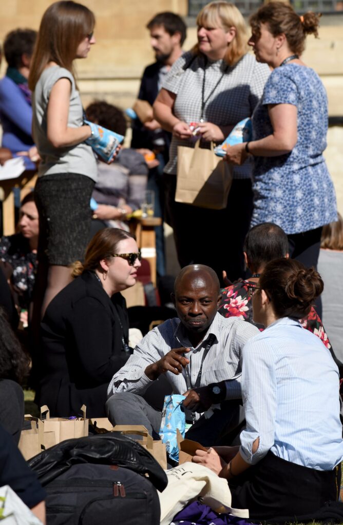 Delegates sitting outside at lunchtime 