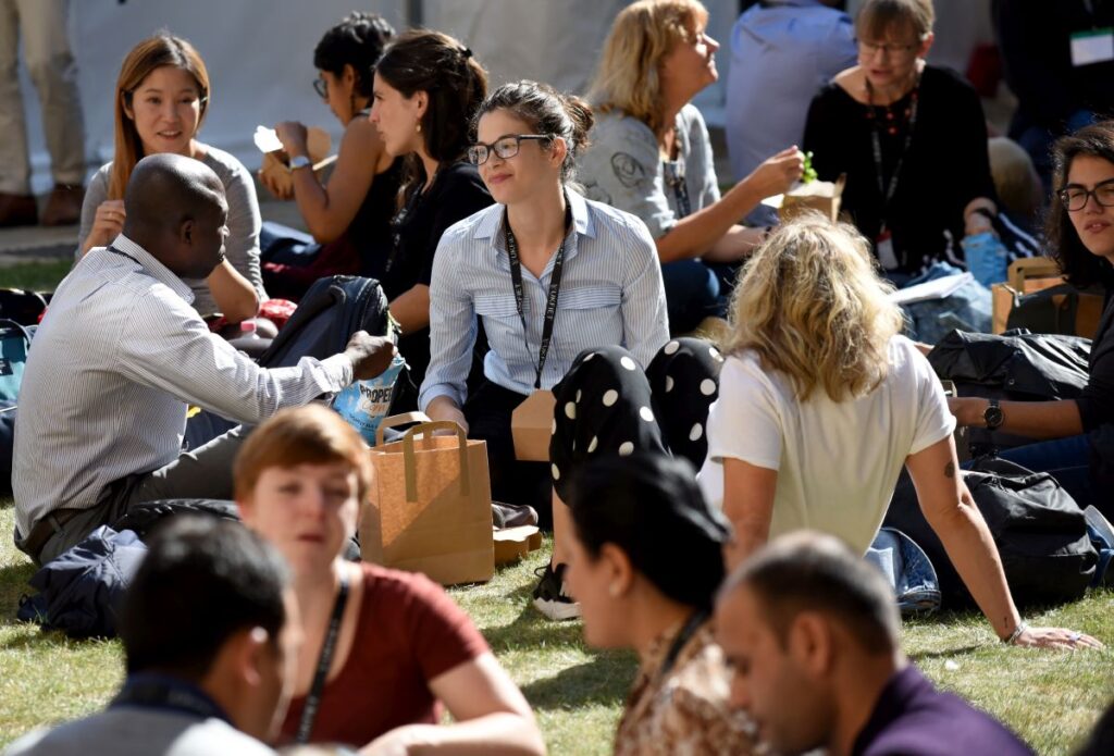 Delegates sitting outside at lunchtime 