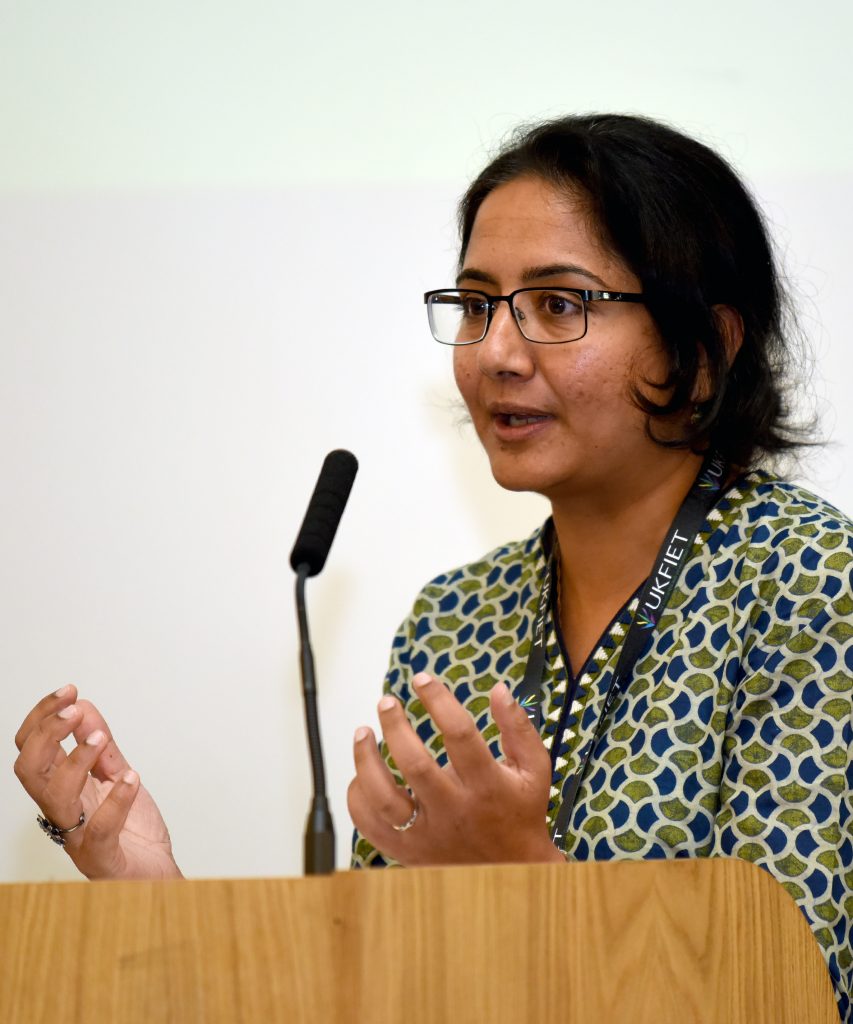 A female presenter at the conference