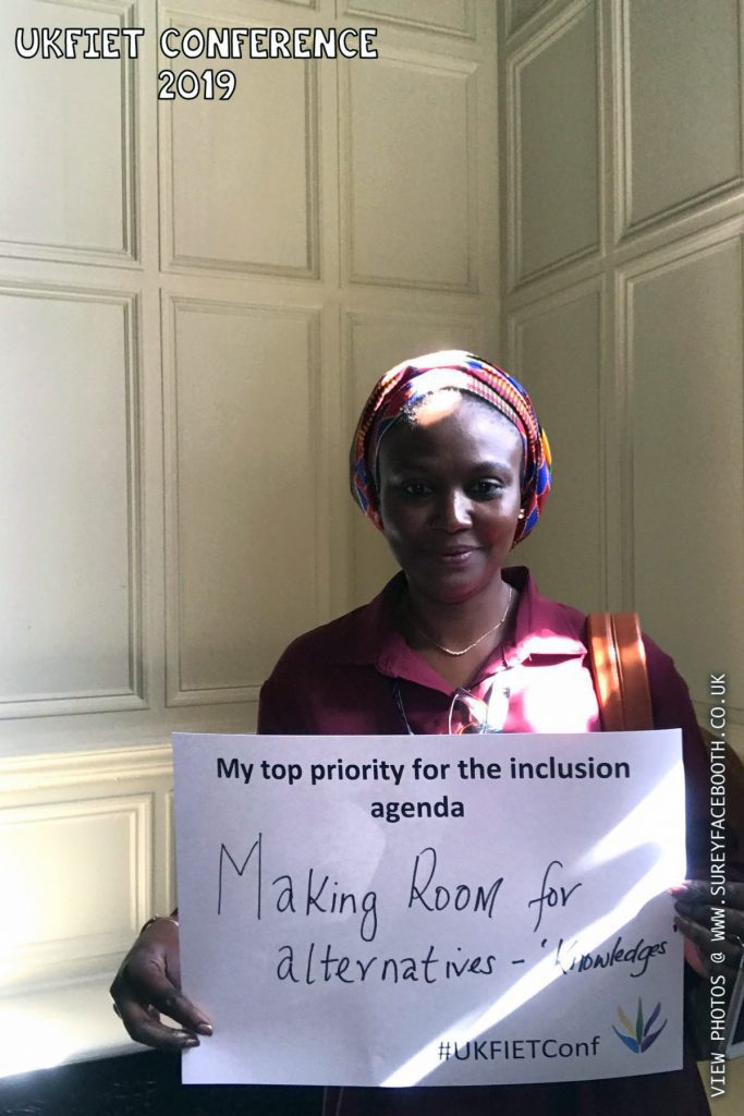 Hadiza Abdulrahman holds up a card My top priority for the inclusion agenda: Making room for alternative - "knowledges"