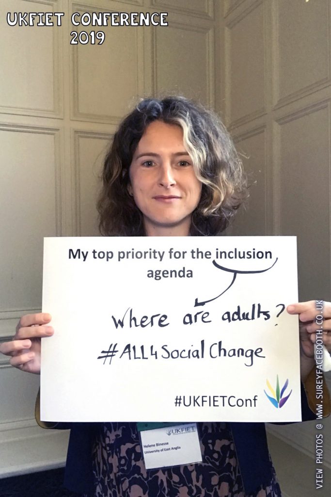 Helene Binesse holds up a card My top priority for the Inclusion Agenda : Where are the adults? #All4SocialChange