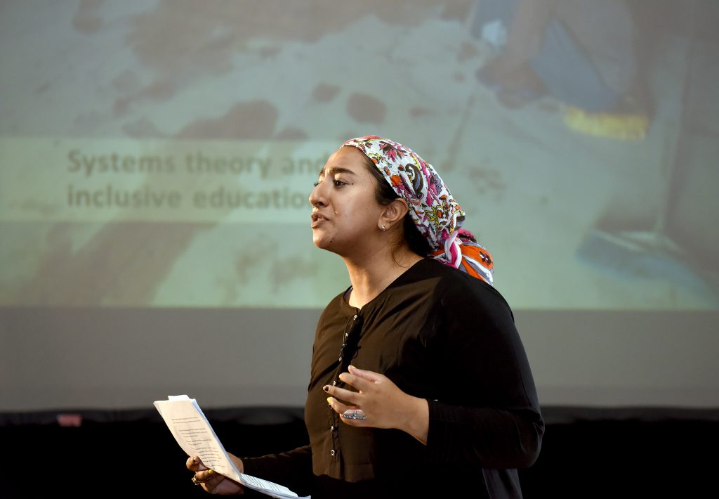 A female actor playing Abebe at the conference