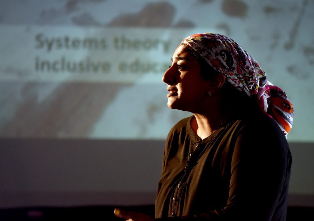 A female actor playing Abebe at the conference