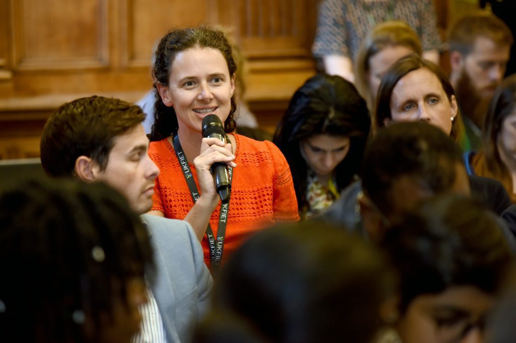 A female delegate asking a question at the 2019 BAICE Plenary