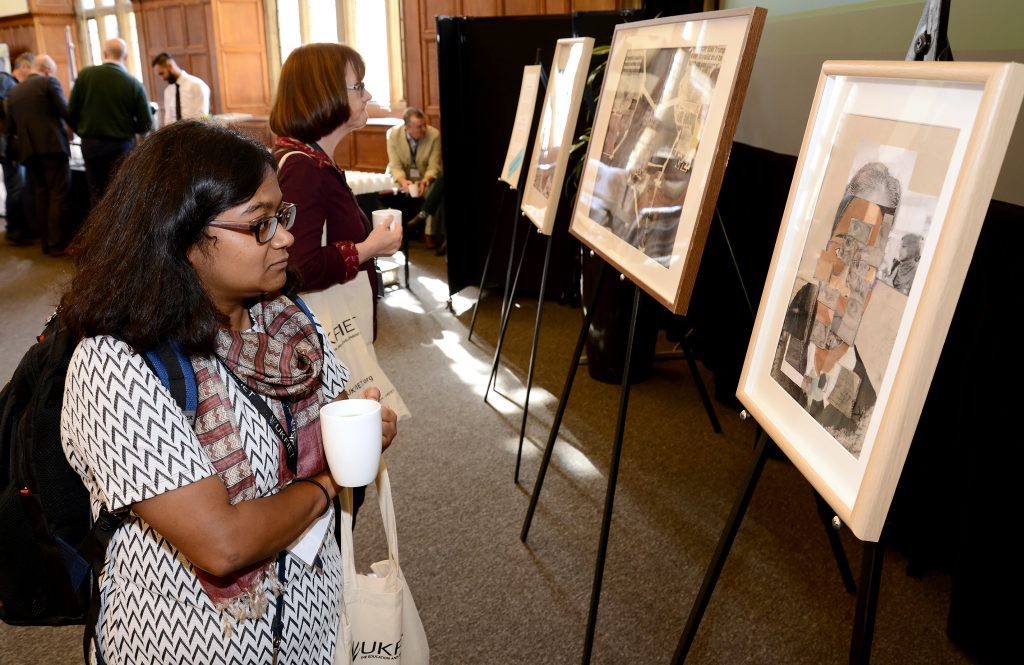 Delegates look at artwork 2019