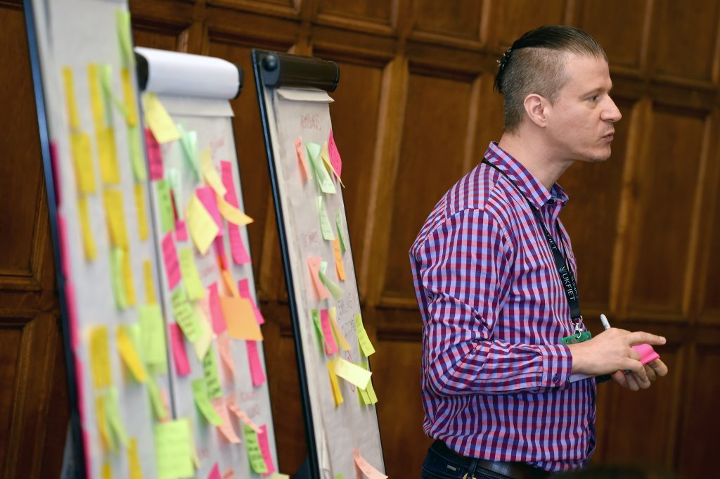 Delegate in a workshop with flipcharts
