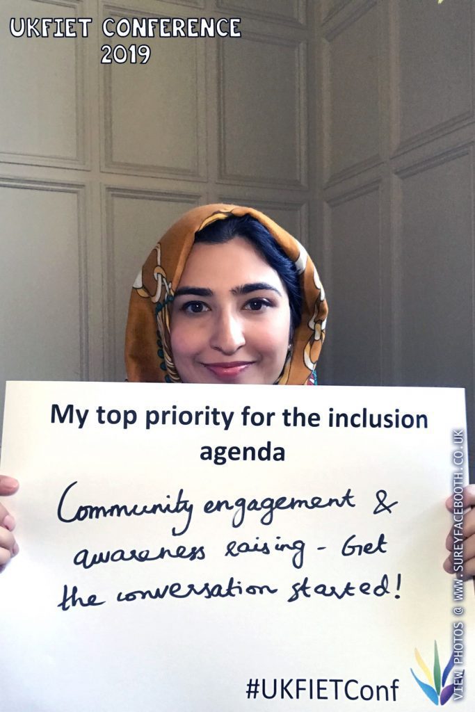 UKFIET Conference 2019 - Maria Qureshi holding up a card pre printed with My top priority for the inclusion agenda - hand written Community engagement & awareness raising - get the conversation started!