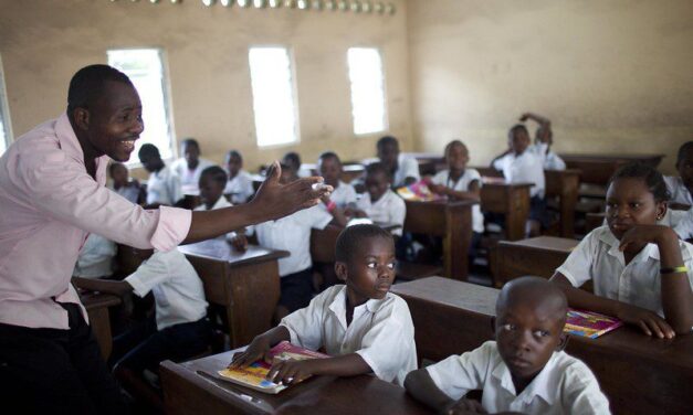 4th grade teacher asking his students questions at the St. Louis Primary School in Kinshasa, Congo