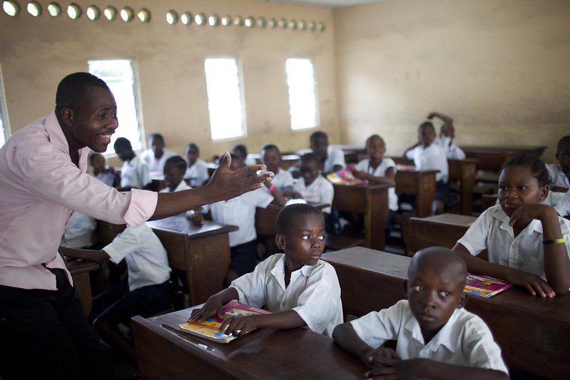 4th grade teacher asking his students questions at the St. Louis Primary School in Kinshasa, Congo