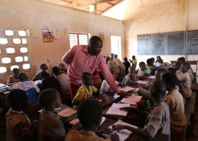 Male teacher in african classroom