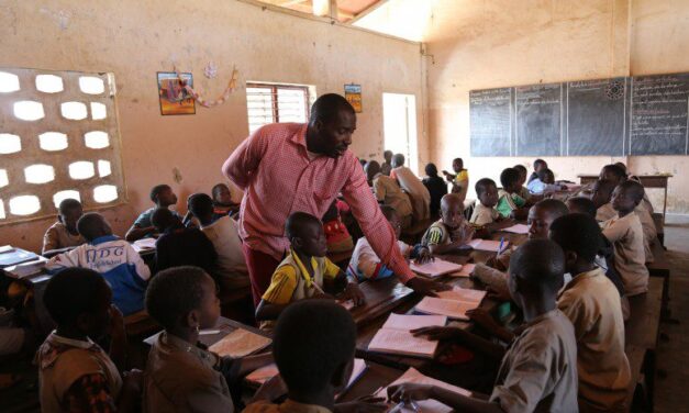 Male teacher in african classroom