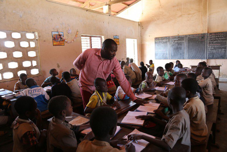 Male teacher in african classroom