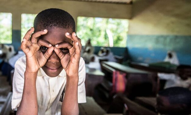 A student imitates a pair of glasses, during a screening excercise and spectacle distribution by Sightsavers at the Jongowe secondary school on Tumbatu island, Zanzibar.
